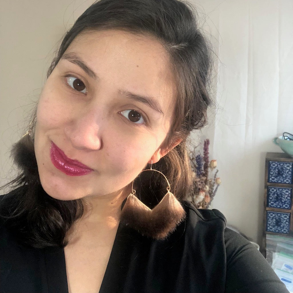Bold earrings create a bold mood