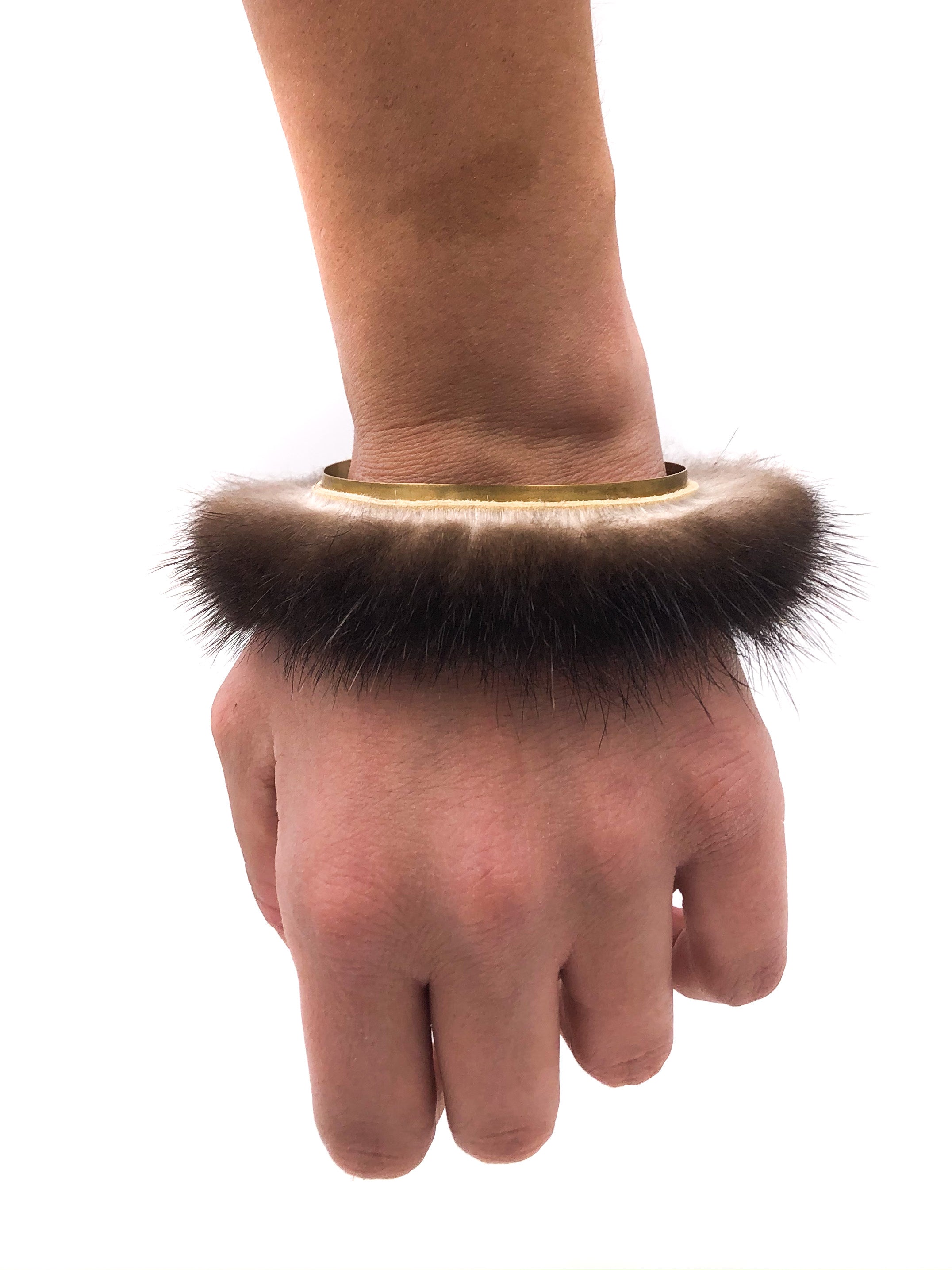 Fur bracelet with brass adornment and a little bit of attitude 